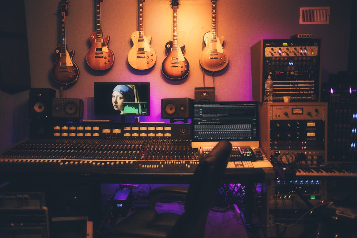 Recording studio mixing console with faders and knobs